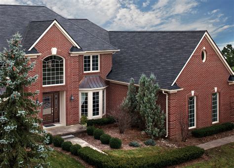 red brick house with charcoal metal roof|black roof for red brick house.